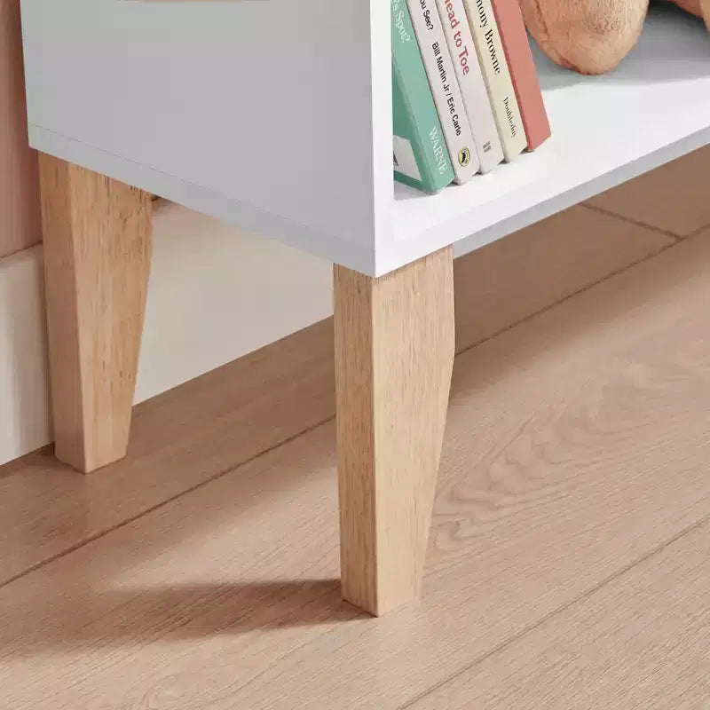 Bibliothèque autoportante blanche en forme de maison de poupée à 8 compartiments pour livres d'enfants ou figurines, avec pieds en hêtre